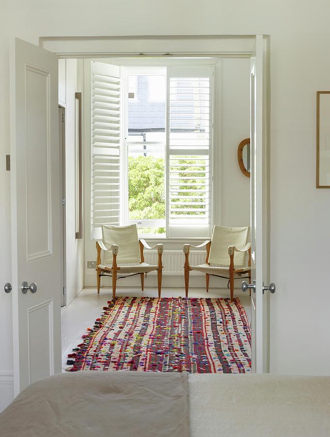 Furniture Photograph - Open Double Doors With View Of Colourful Rug And Delicate Armchairs With Ecru Covers Below Window by Rachael Smith