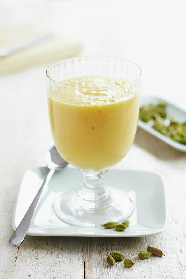 Orange And Cardamom Milk Pudding In A Dessert Glass Photograph by Charlotte Tolhurst