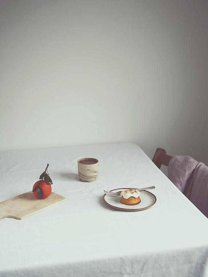 Orange Cake On A Table Photograph by Lukejalbert