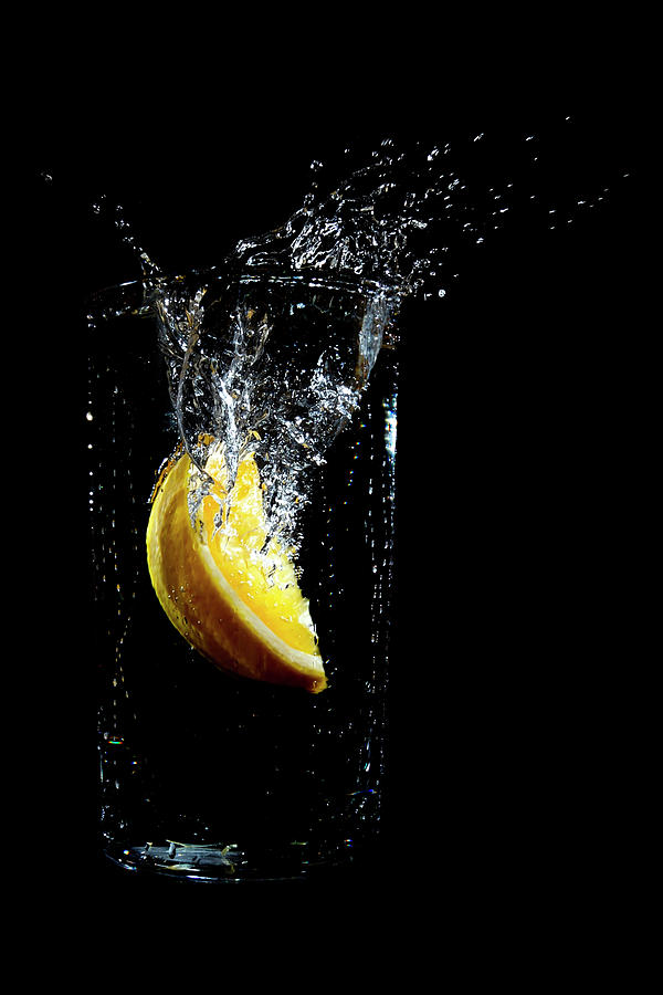 Orange Dropped Into A Glass Of Water Photograph by Luke Peterson Photography