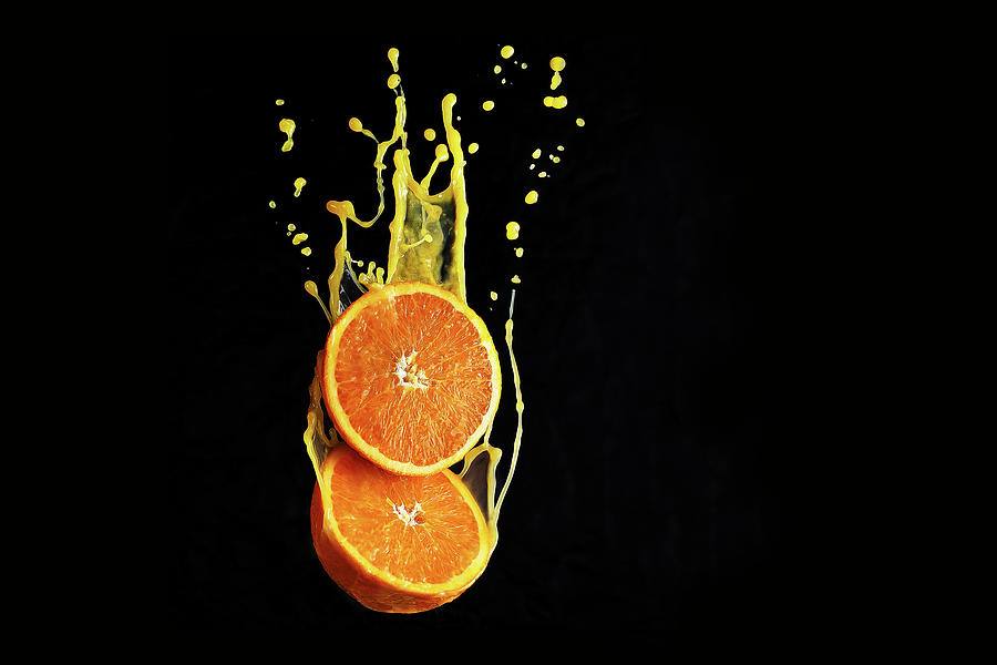 Orange Flying In The Juice Splashes Photograph by Kristina Zvereva