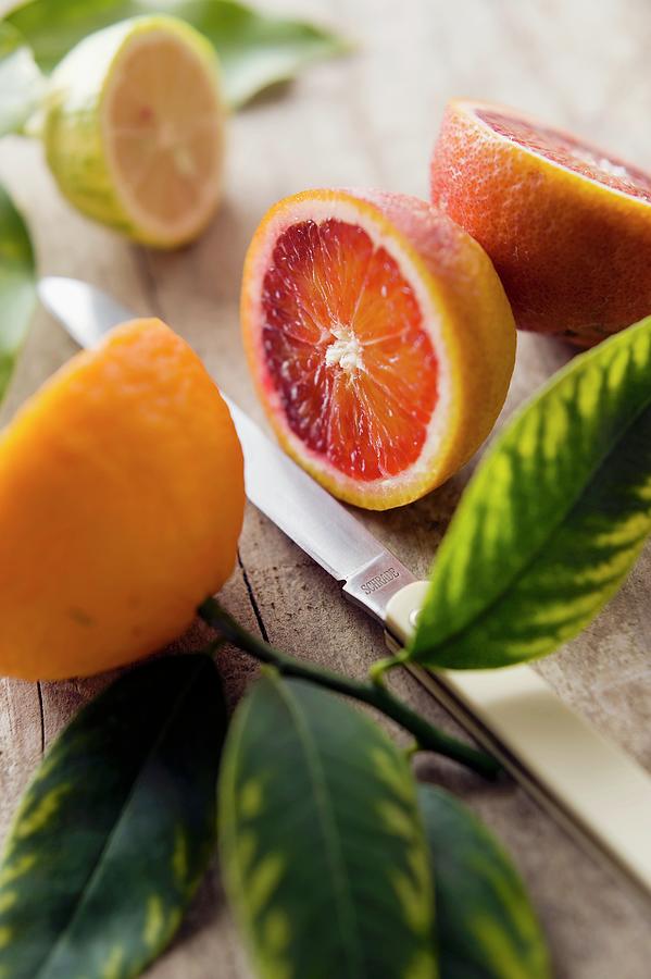 Orange Halves And Half A Lemon Photograph by Frederic Vasseur