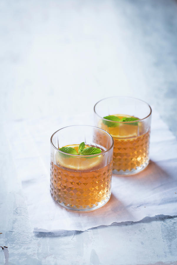 Orange Iced Tea With Mint Photograph by Manuela Rther
