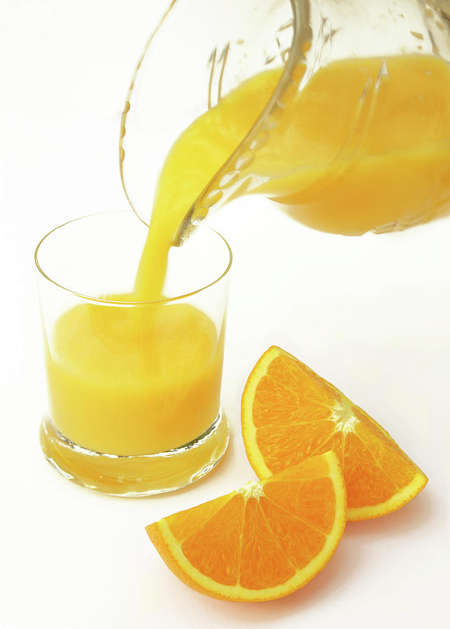Orange Juice Freshly Prepared For Photograph by Rosemary Calvert