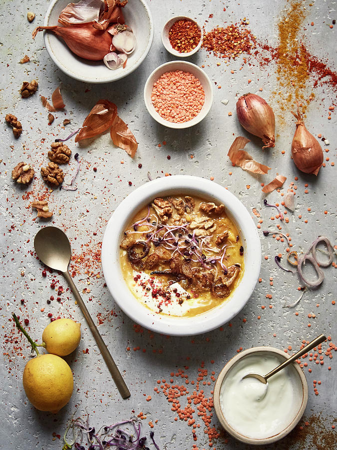 Orange Lentil And Sweet Potato Soup With Walnuts And Crisp Shallots Photograph by Zo & Blaise
