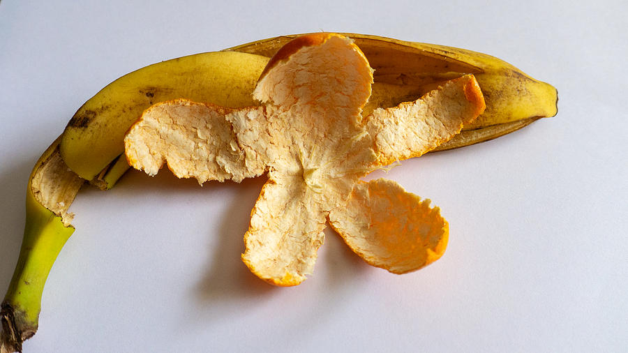 Orange on Banana Photograph by Ivars Vilums