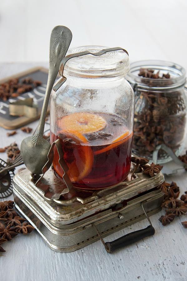 Orange Punch With Star Anise In A Preserving Jar Photograph by Martina Schindler