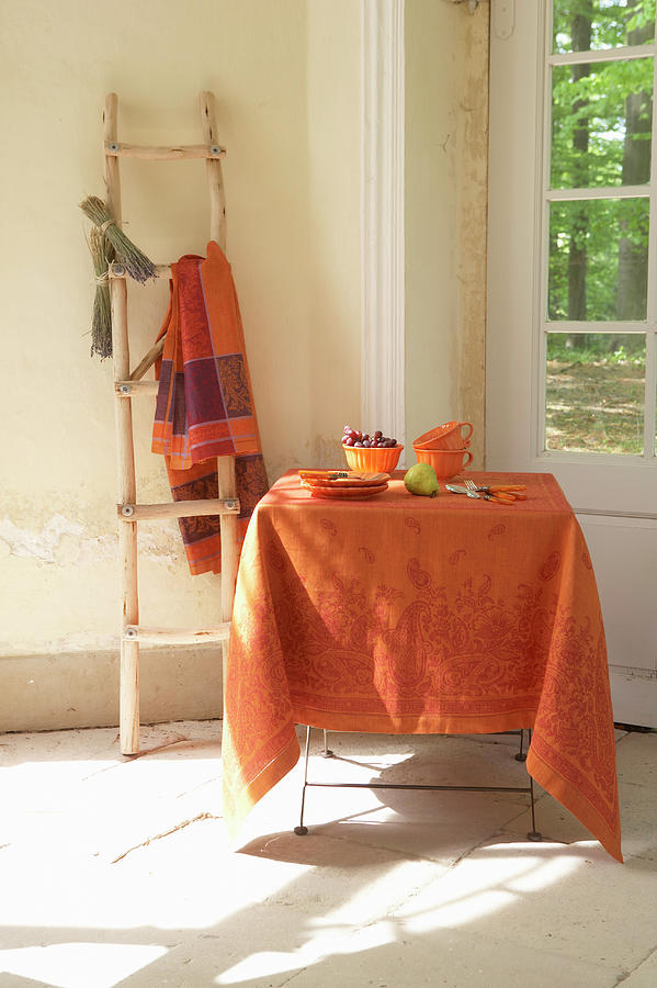 Orange Tablecloth And Late-summer Decorations On Table Photograph by Werner Krauss