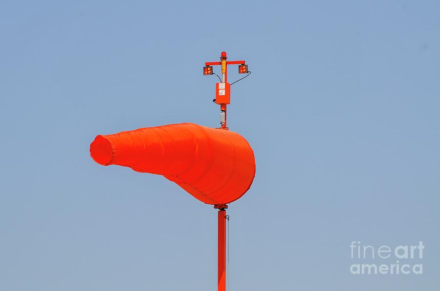Orange Windsock Against A Blue Sky Photograph by Photostock-israel/science Photo Library