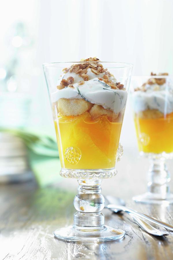 Orange-yoghurt Trifle With Muesli Photograph by Jalag / Bernd Grundmann