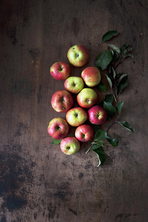 Organic Apples On A Dark Wooden Surface seen From Above Photograph by Malgorzata Laniak
