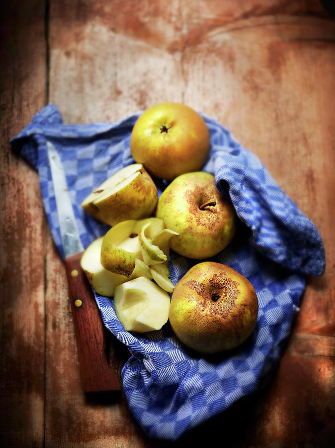 Organic Apples On A Tea Towel With A Knife Photograph by Frdric Perrin