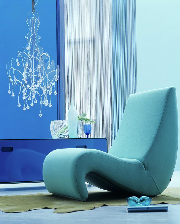 Organic Easy Chair In Blue Interior With Modern Chandelier Photograph by Matteo Manduzio