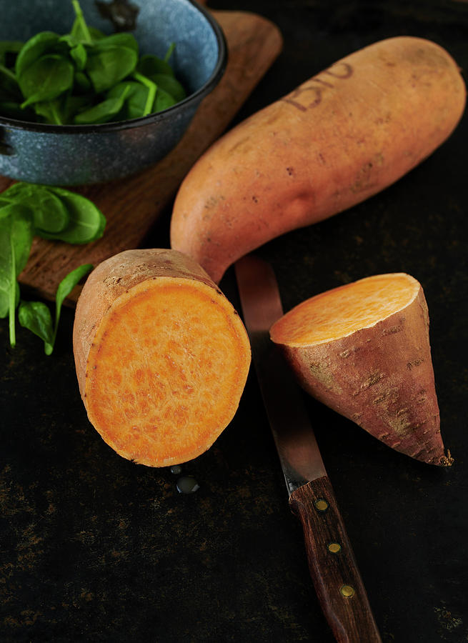 Organic Sweet Potato And Baby Spinach Photograph by Stefan Schulte-ladbeck