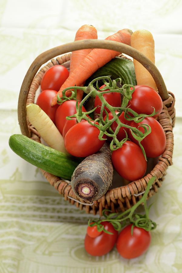 Organic Vegetables In A Basket Photograph by Alain Caste