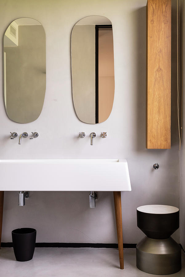 Organically Formed Mirrors Above Sink On Cabinet Legs Photograph by Celeste Najt