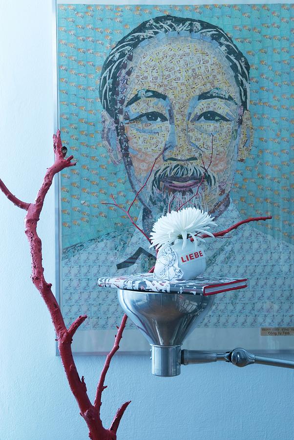 Oriental Arrangement: Red-painted Branch And Book On Upturned Lamp Used As Tray In Front Of Large Portrait Photograph by Matteo Manduzio