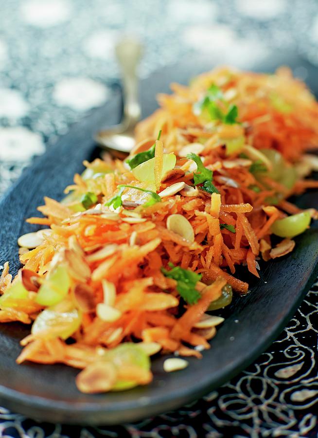 Oriental Carrot Salad With Grapes Photograph by Lars Ranek