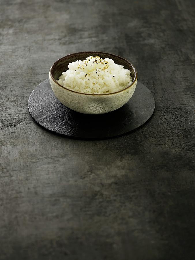 Oriental Rice Topped With Sesame Seeds Photograph by Mikkel Adsbl
