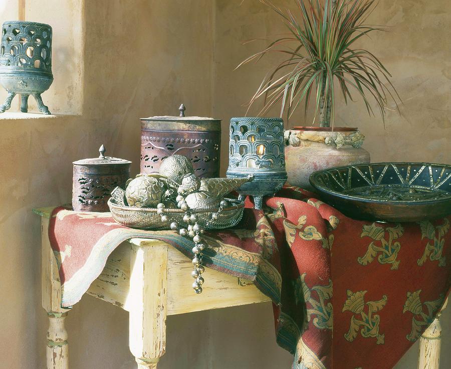 Oriental-style Bowls And Lidded Jars On Tablecloth On Rustic Table In Corner Photograph by Twins
