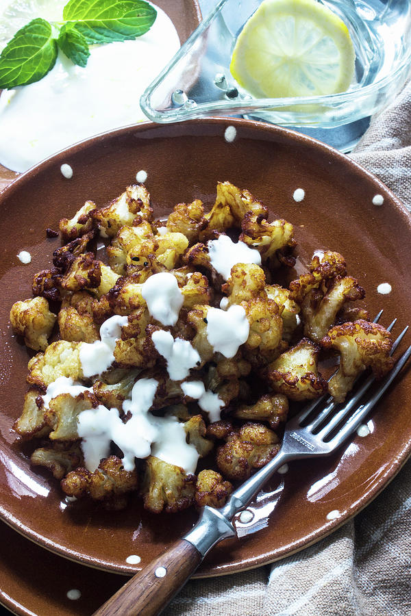 Orientalstyle Fried Cauliflower With Yoghurt Sauce Photograph by