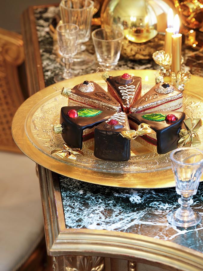 Ornamental Cake Slices On A Brass Tray Next To Crystal Glasses On An Antique Table With A Stone Top Photograph by Matteo Manduzio
