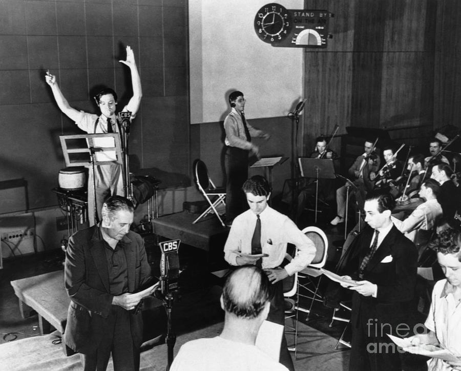 Orson Welles Photograph - Orson Welles Rehearsing Radio Broadcast by Bettmann