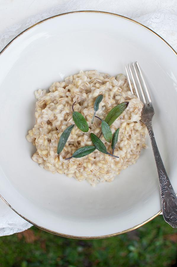 Orzotto - Barley Risotto, Traditional Italian Dish. Pear Barley With Butter, White Wine, Parmesan Cheese, Gorgonzola And Sage Photograph by Kachel Katarzyna