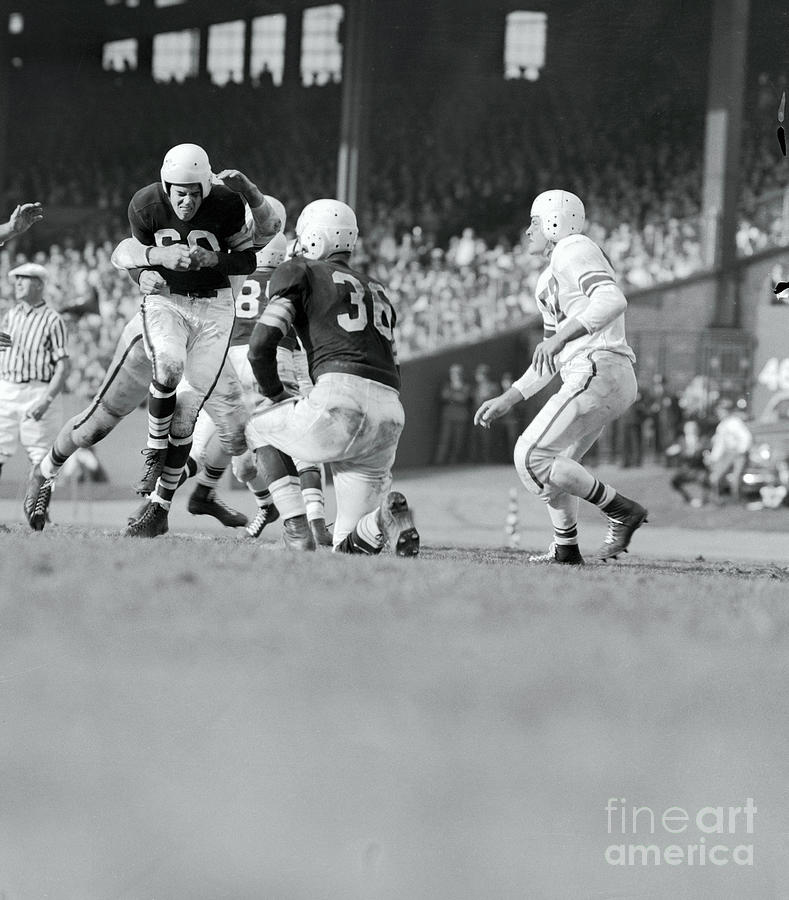 Otto Graham Being Hit During Game Photograph by Bettmann Otto Graham Being Hit During Game Photograph by Bettmann