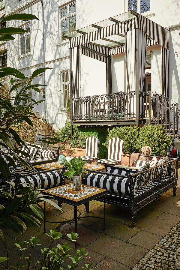 Outdoor Furniture On Terrace And Roofed Balcony With Pelmets And Curtains Photograph by Misha Vetter