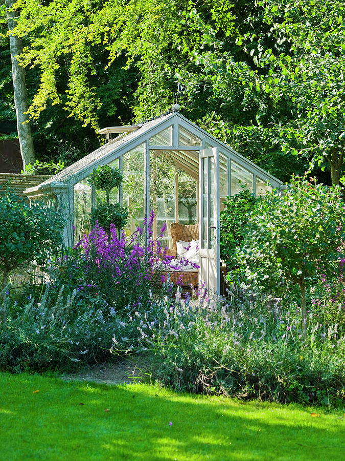 Outdoor Living Room In Greenhouse Amongst Perennials And Shrubs ...