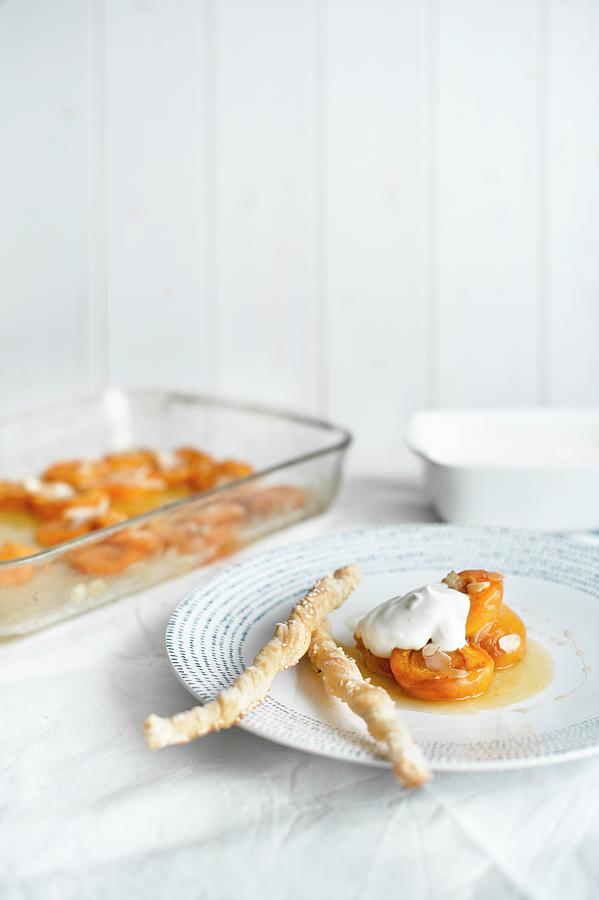 Oven-baked Apricot With Flaked Almonds And Honey Serve With Greek Yoghurt And Sesame Seed Pastries Photograph by Magdalena Hendey