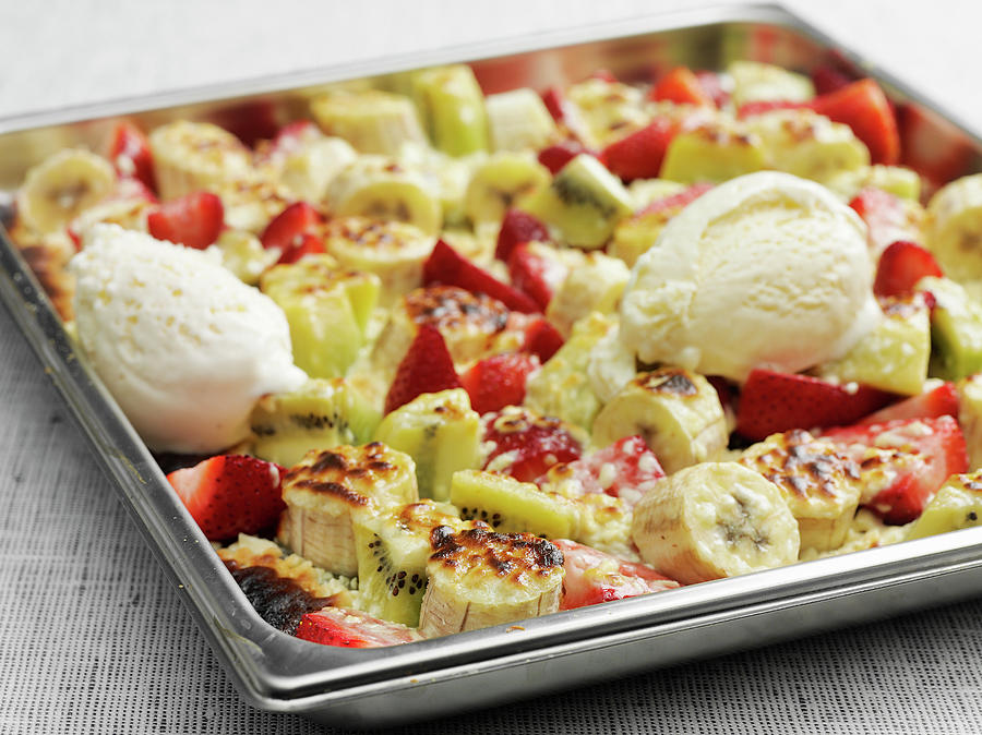 Oven-baked Fruit On A Baking Sheet Served With Vanilla Ice Cream Photograph by Pepe Nilsson