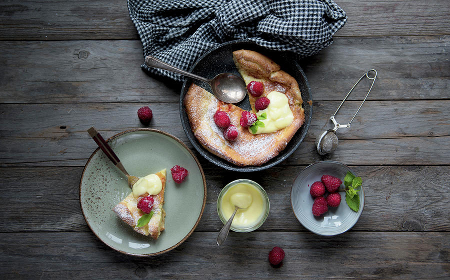 Oven Baked Pancakes With Lemon Cream And Raspberries Photograph by Valentina T.