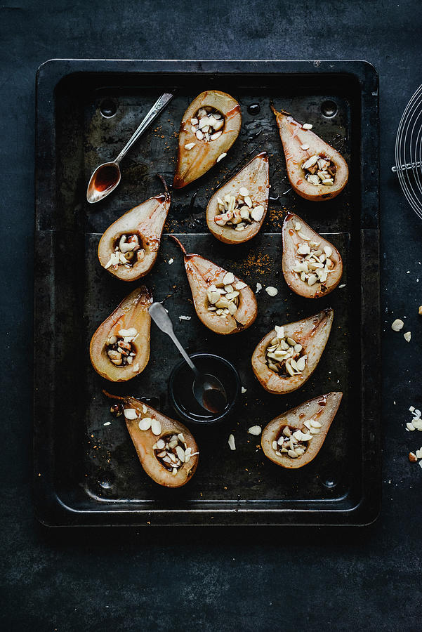 Oven-baked Pear Halves Filled With Almond Flakes Photograph by Kasia Wala