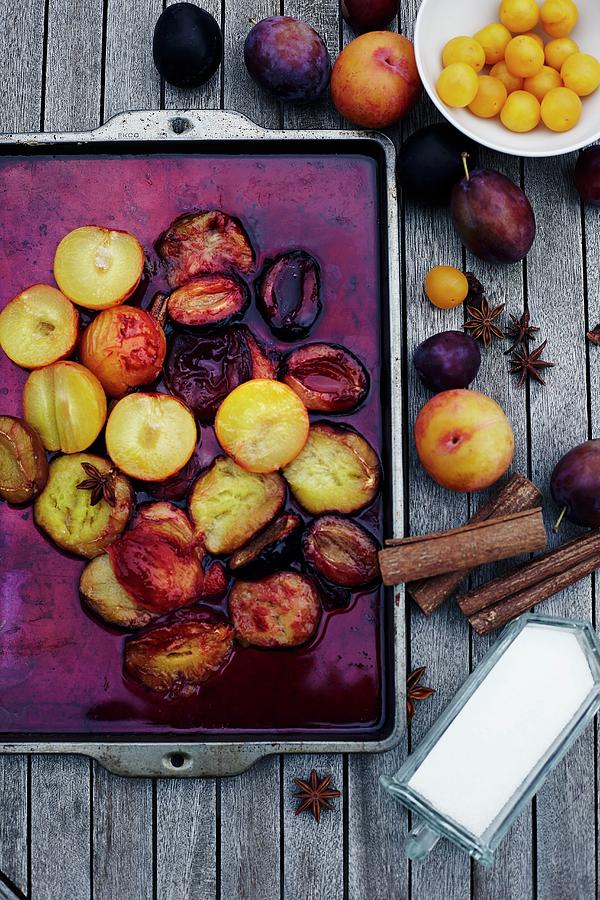 Oven-baked Plums With Star Anise And Cinnmon Photograph by Aina C. Hole