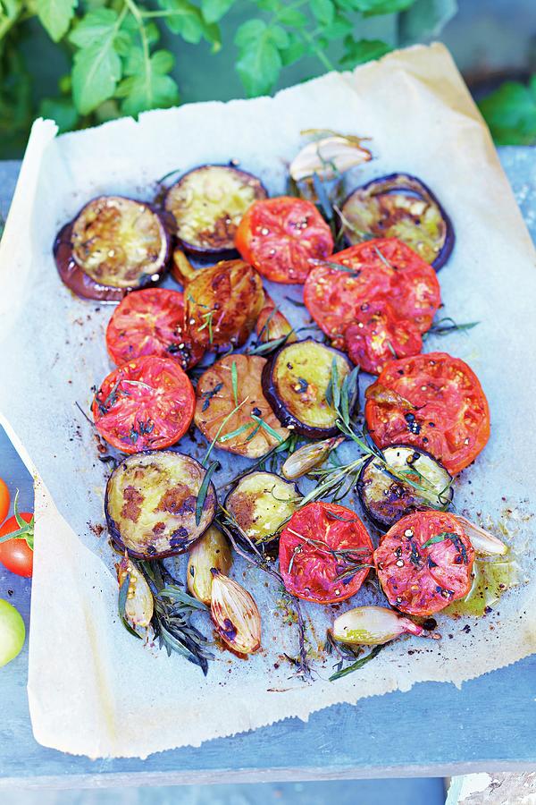 Oven-baked Tomatoes And Aubergines Photograph by Jalag / Janne Peters