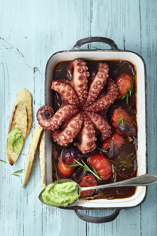 Oven Roast Octopus With Tomatoes And Rosemary Photograph by Ulrike Holsten / Stockfood Studios