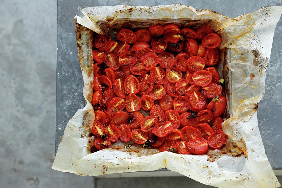 Oven-roasted Cherry Tomatoes On A Baking Tray Photograph by Danya Weiner