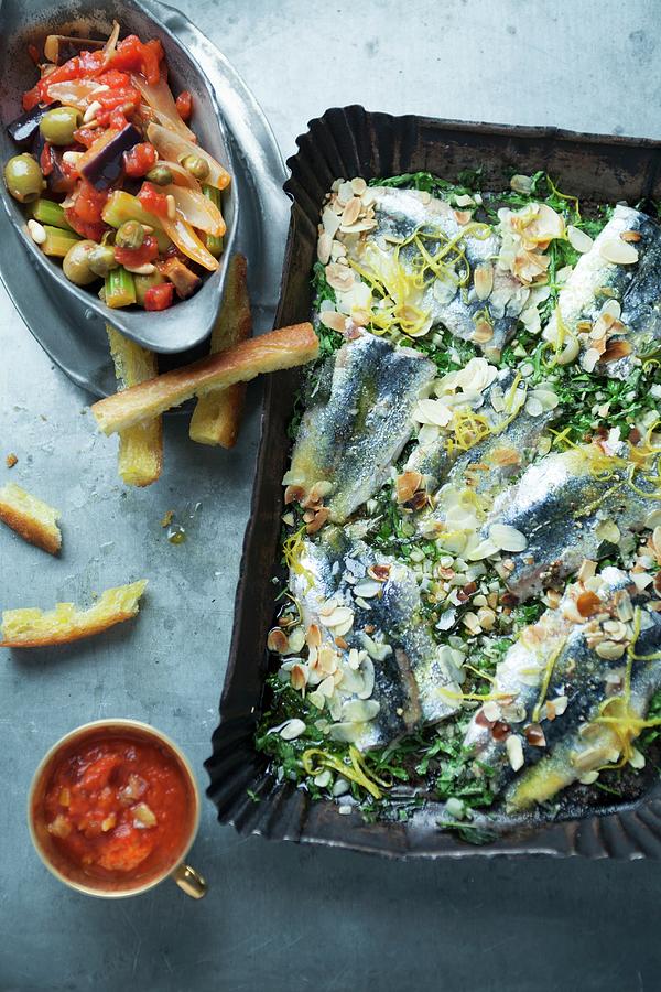 Oven-roasted Sardines With Lemon And Flaked Almonds Photograph by Joerg Lehmann