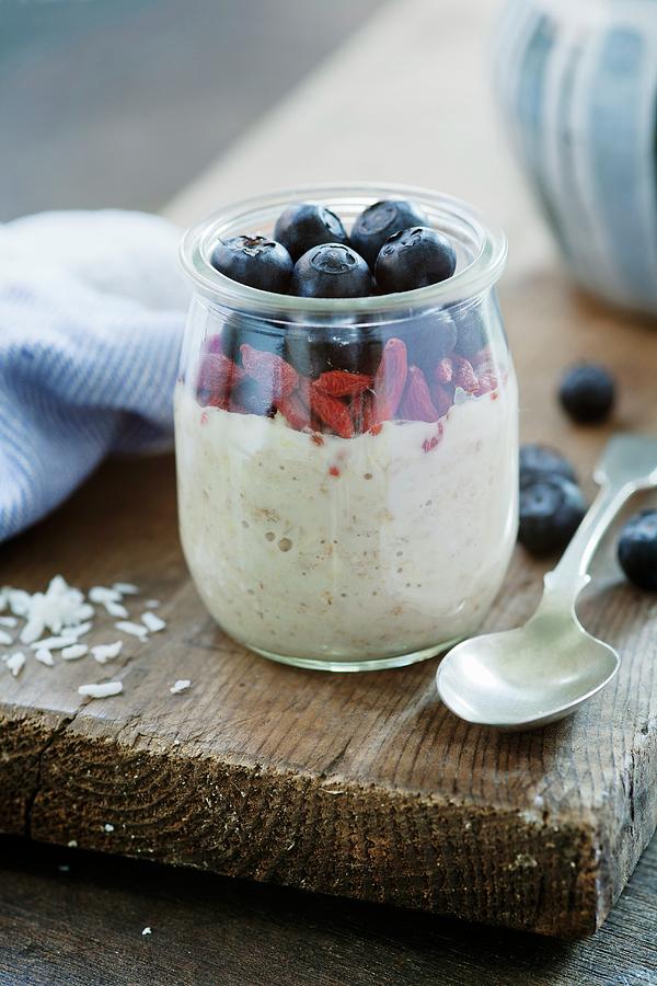 Overnight Oats, Soaked In Coconut Milk With Blueberries And Goji Berries Photograph by Victoria Firmston