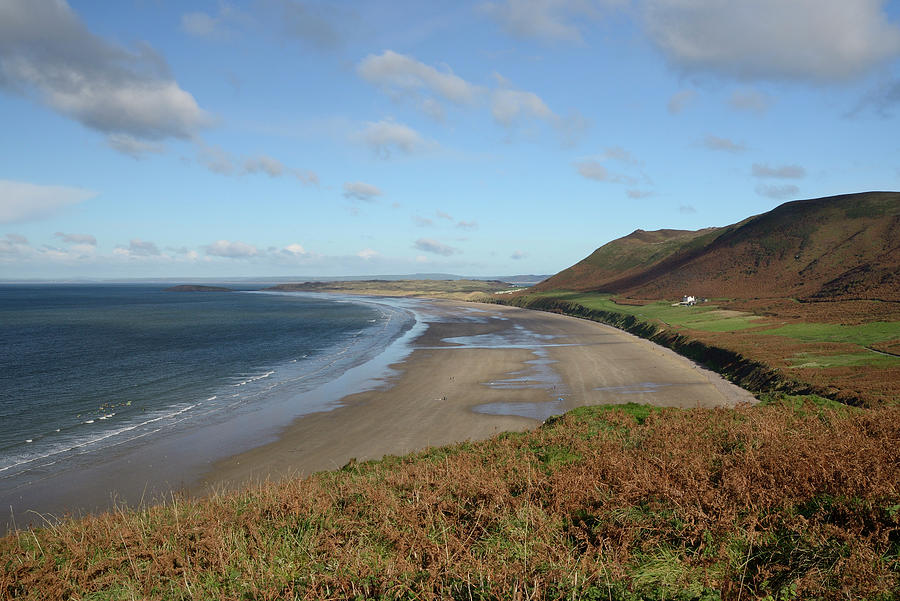 Overview Of Rhossili Bay At Low Tide With Waves Lapping Photograph by