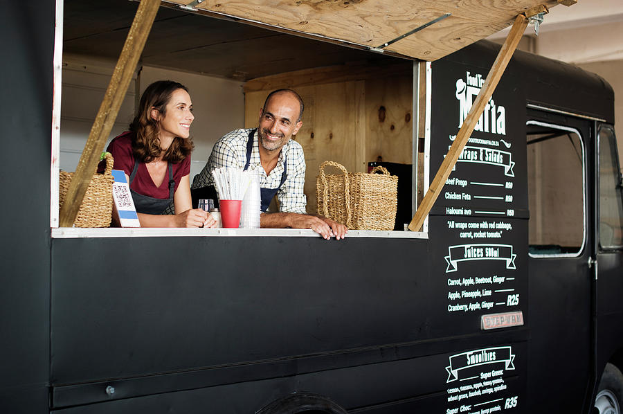 Owners Standing In Food Truck Photograph by Cavan Images - Pixels