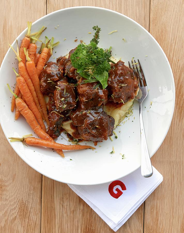 Oxtail Ragout On Mashed Potatoes And Parsnips With Carrots Photograph by Robbert Koene