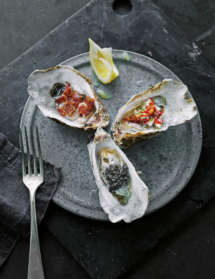 Oyster Appetisers With Lemon Photograph by Lars Ranek
