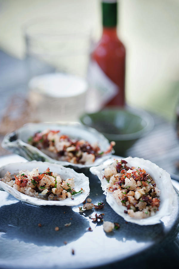 Oysters With Pancetta And Pine Nuts Photograph by Colin Cooke
