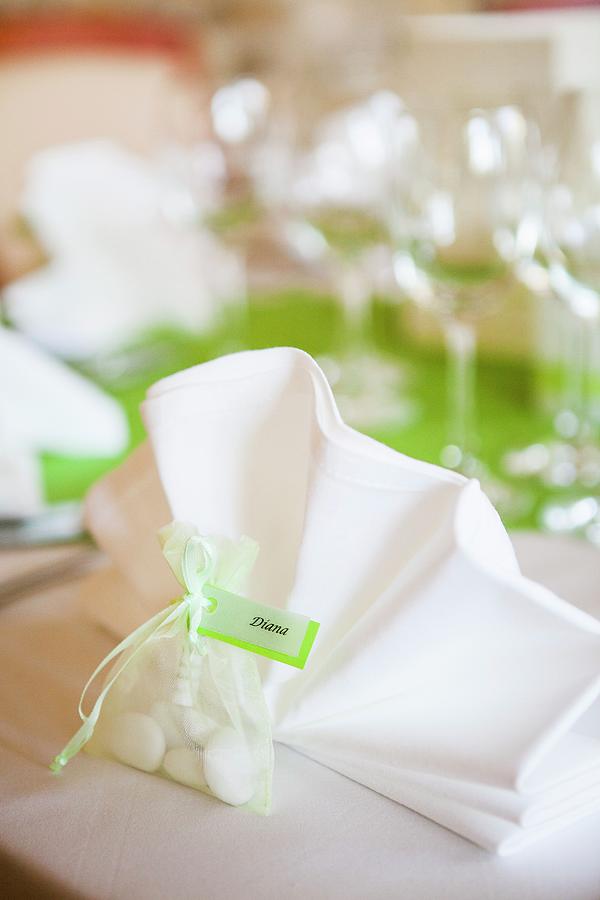 Packet Of Sweets Used As Name Tag On Wedding Dinner Table Photograph by Jan Wischnewski