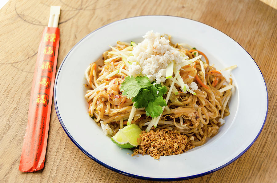 Pad Thai Stir Fried Noodles With Prawns, Chilli, Beans, Sprouts, Spring Onions, Carrots, Crab Meat, Shredded Apple, Lime And Peanut Photograph by Giulia Verdinelli Photography