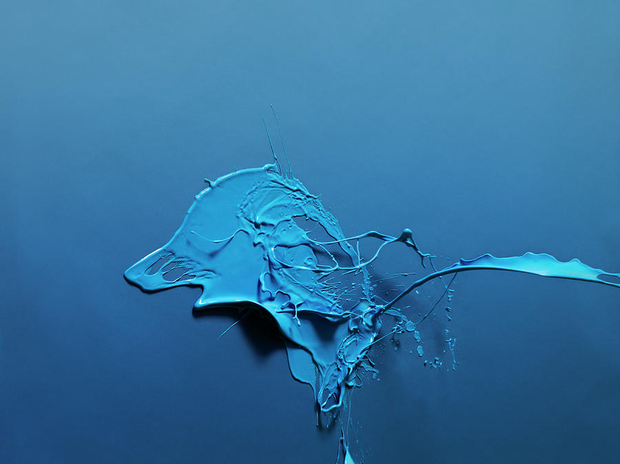 Paint Splashed On Blue Surface Photograph by Henrik Sorensen
