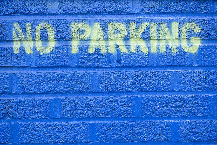 Painted Blue Brick Wall With No Parking Photograph by John Nordell